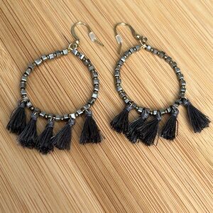 Gold tone and gray tassel earrings